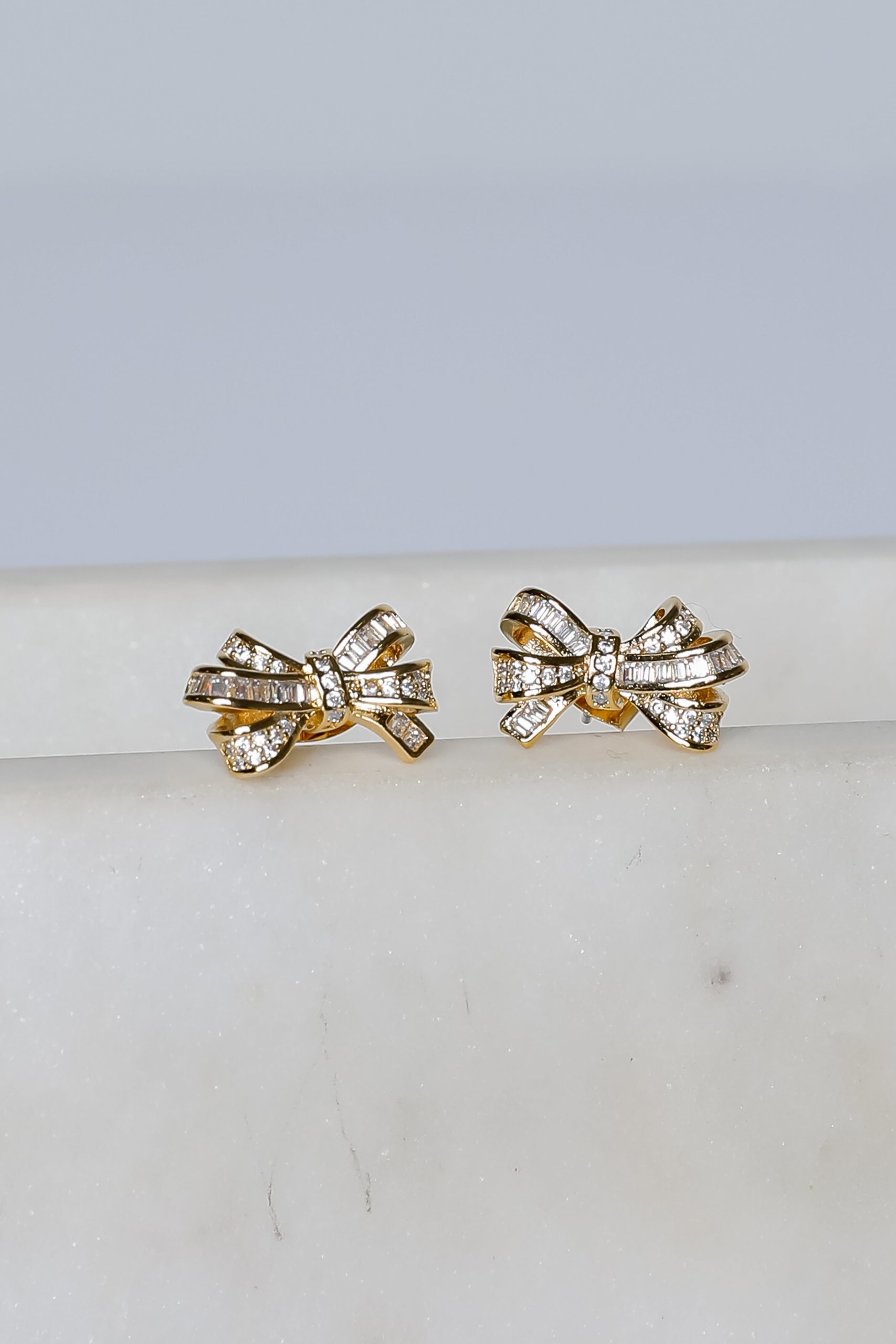 shopdressup_gold_rhinestone_bow_earrings_216dc3e9-e742-4832-bc71-fcaacbd5f077.jpg