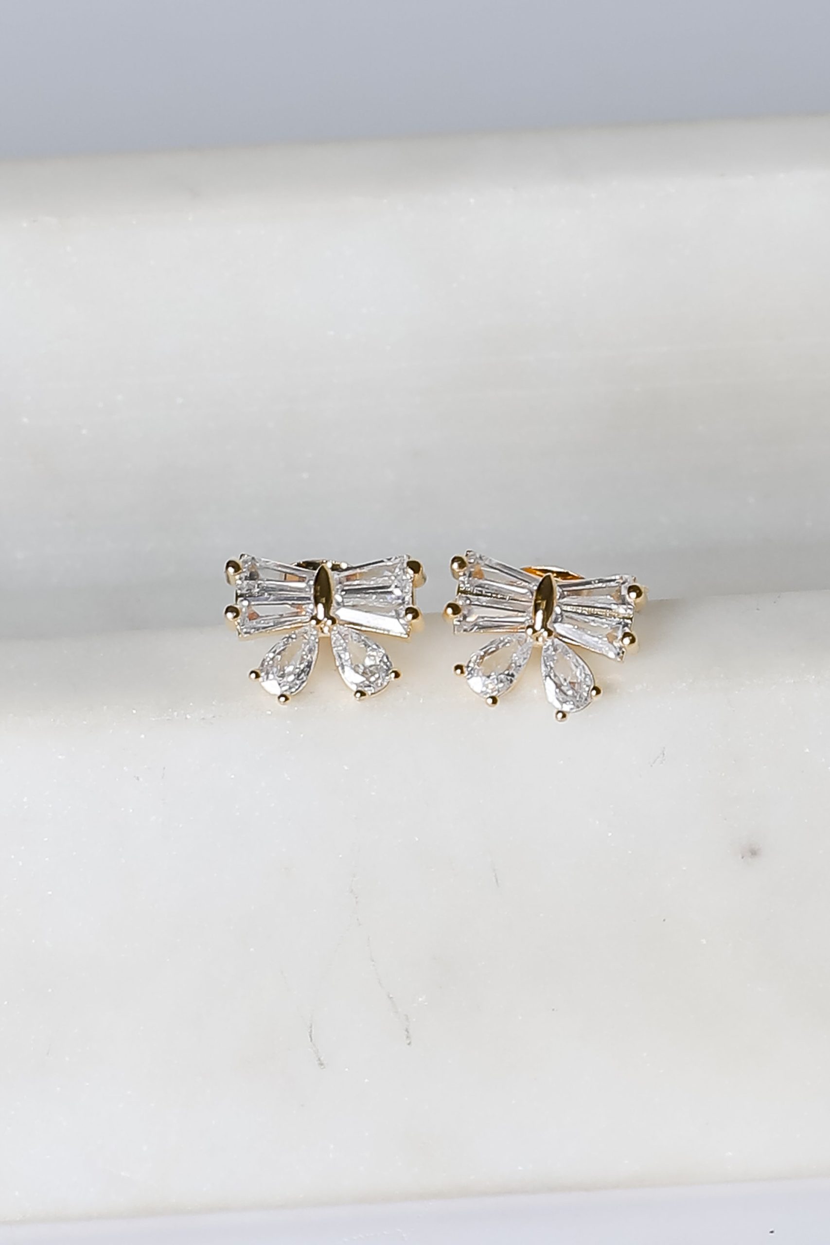 shopdressup_gold_rhinestone_bow_studs-2.jpg